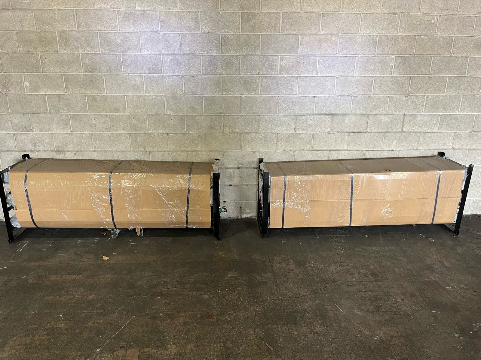Two strapped cardboard freight crates ready for lift-gate unload