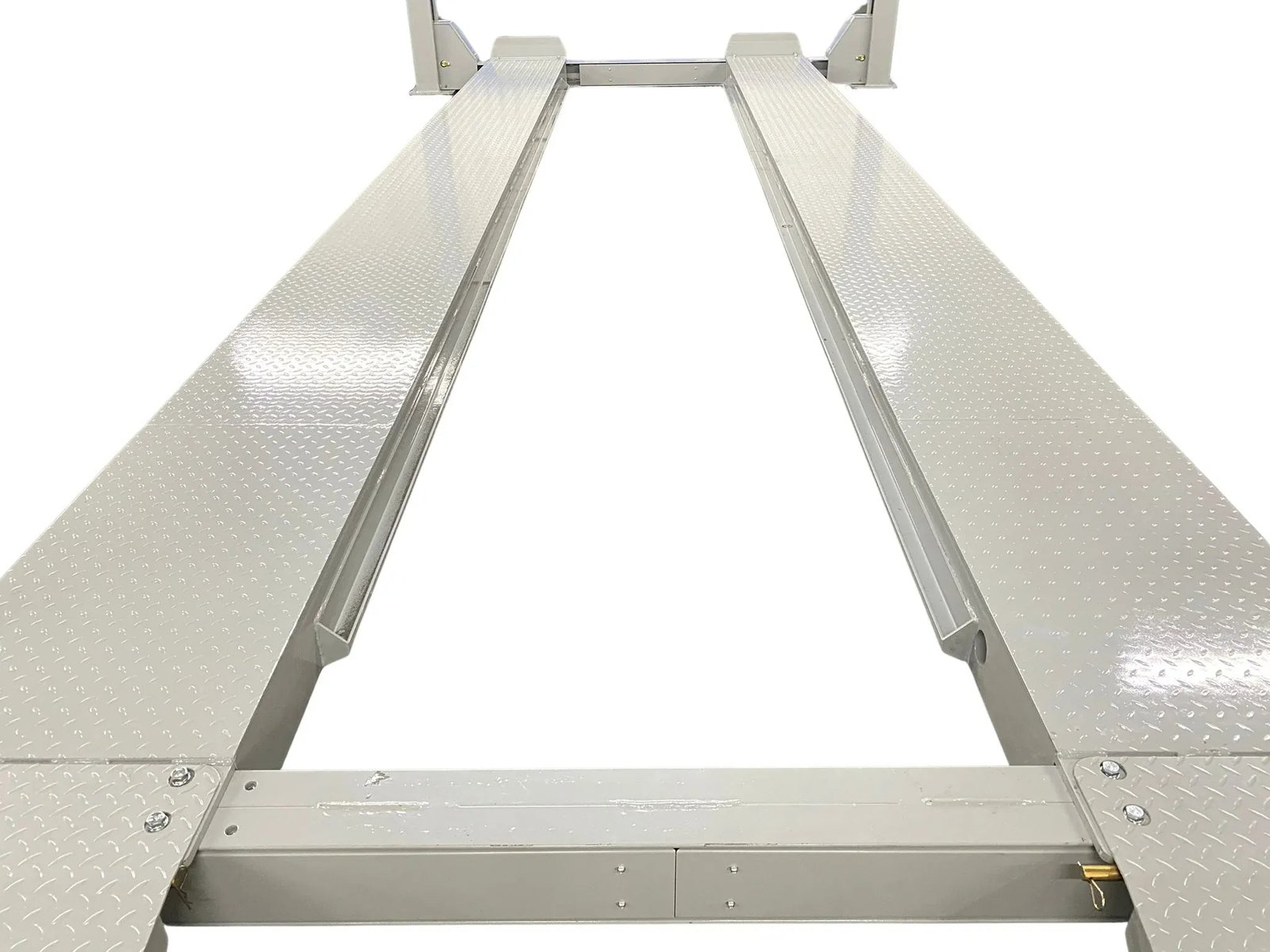 Top view down the runways of a four-post lift showing the inner cross-rails the bridge jack tracks on