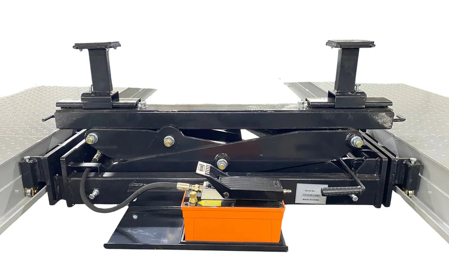 Rolling bridge jack with two height adapters fitted on the lifting pads, scissor mechanism and foot pedal visible